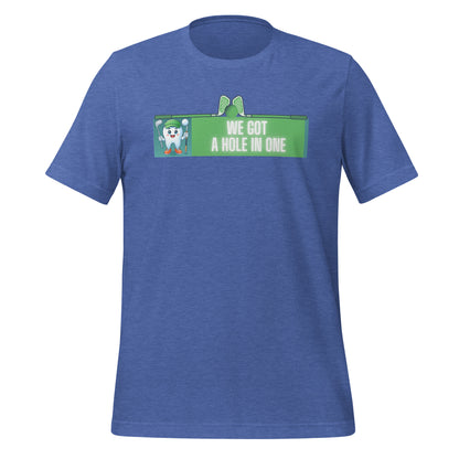 Cute dentist t-shirt showcasing an adorable tooth character in golf attire, joyfully celebrating a ‘hole in one’ achievement, perfect for dentist and dental professionals seeking unique and thematic dental apparel. Heather true royal color, front view.