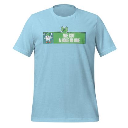 Cute dentist t-shirt showcasing an adorable tooth character in golf attire, joyfully celebrating a ‘hole in one’ achievement, perfect for dentist and dental professionals seeking unique and thematic dental apparel. Ocean blue color, front view.